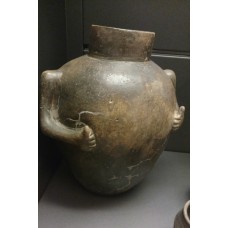 Cinerary clay vase, designed with arms doing thumbs up